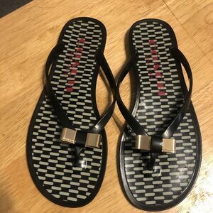 Coach Landon jelly  black flip flop thong sandals with gold bow, size 6